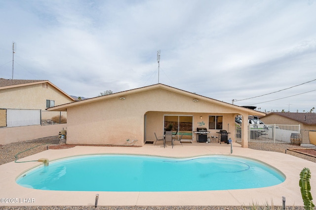 view of pool with a patio, a fenced backyard, a grill, and a fenced in pool