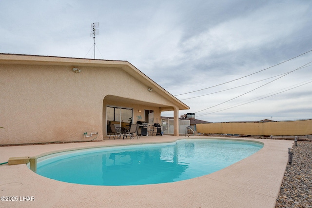 view of pool with a grill, fence, a fenced in pool, and a patio