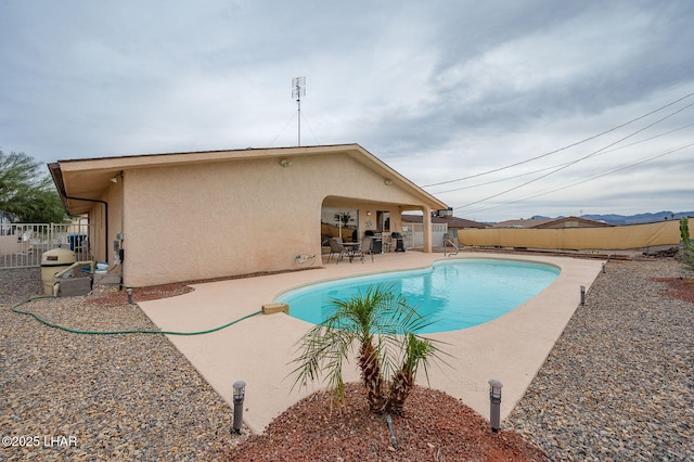 view of swimming pool featuring a patio area, a fenced backyard, and a fenced in pool