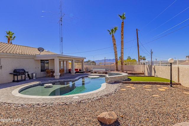 view of swimming pool featuring a fenced in pool, a fenced backyard, grilling area, an in ground hot tub, and a patio area