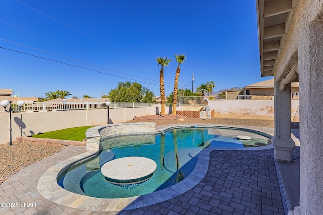 view of swimming pool featuring a fenced backyard, a fenced in pool, and a patio