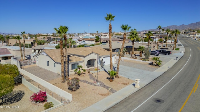 bird's eye view with a residential view and a mountain view