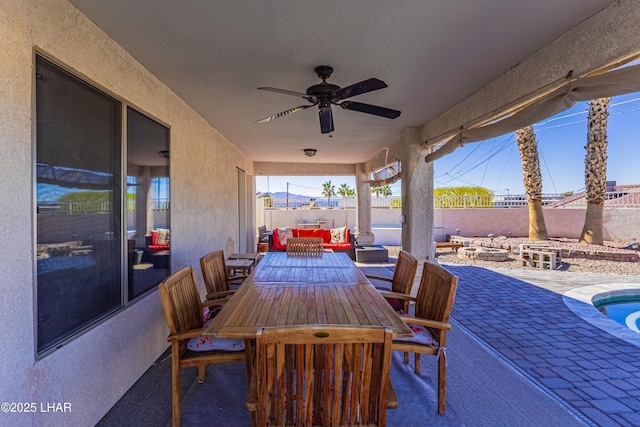 view of patio / terrace featuring an outdoor hangout area, ceiling fan, outdoor dining space, and a fenced backyard