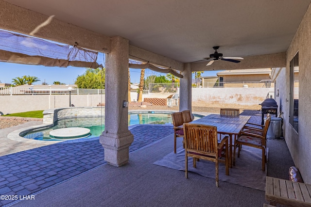 view of patio featuring ceiling fan, outdoor dining area, a fenced backyard, and a fenced in pool