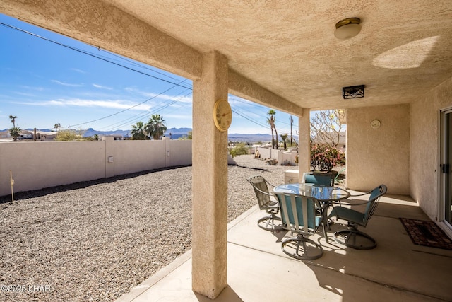 view of patio / terrace featuring outdoor dining space and fence private yard