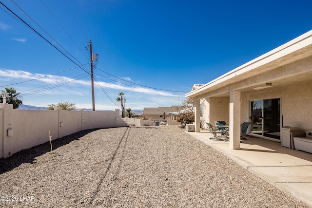 view of yard featuring a fenced backyard and a patio