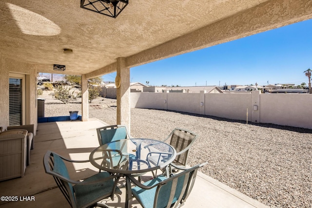 view of patio / terrace featuring outdoor dining space and a fenced backyard