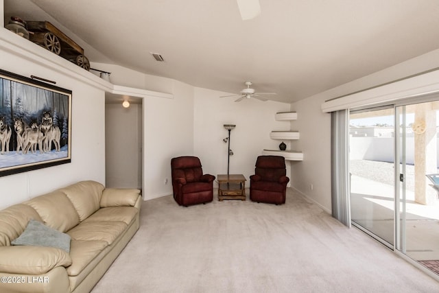 living area featuring ceiling fan, carpet, and visible vents