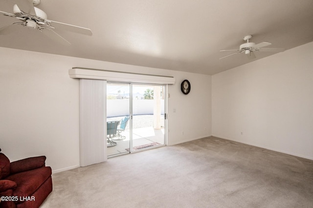 carpeted living room with a ceiling fan