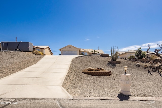 2490 Fannin Dr, Lake Havasu City, AZ 86403 - view of front of property featuring an outbuilding, concrete driveway, and a garage