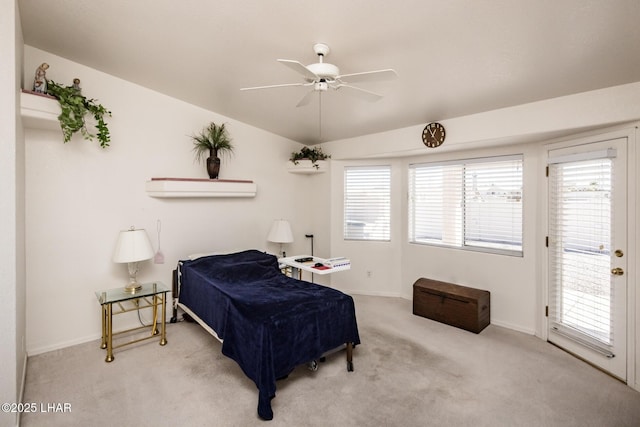 carpeted bedroom featuring lofted ceiling, ceiling fan, and baseboards