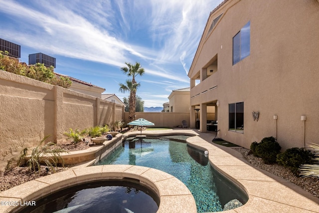 view of swimming pool with a fenced backyard, cooling unit, a fenced in pool, an in ground hot tub, and a patio area