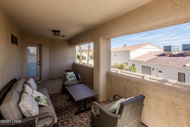 balcony with central AC unit and visible vents