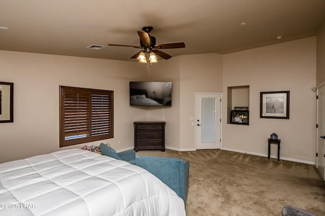 bedroom with visible vents, carpet floors, baseboards, and a ceiling fan