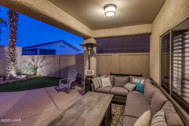 view of patio / terrace featuring an outdoor living space and a fenced backyard