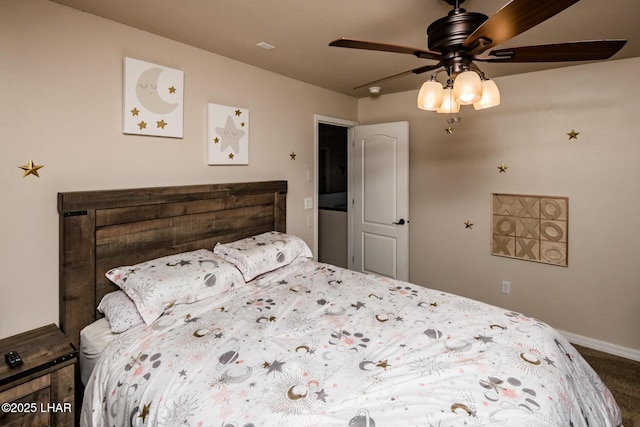 carpeted bedroom featuring baseboards and ceiling fan