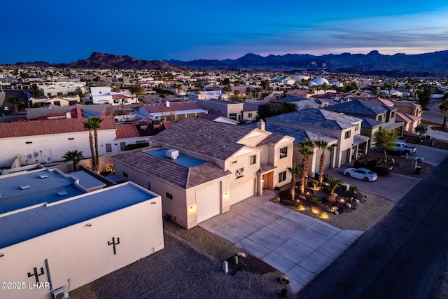 drone / aerial view with a mountain view and a residential view