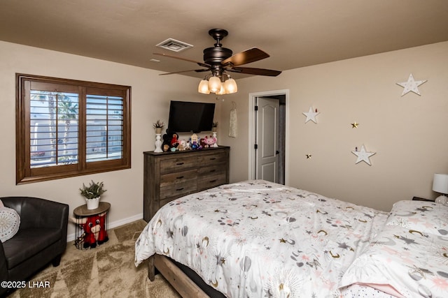 bedroom featuring baseboards, visible vents, carpet floors, and ceiling fan