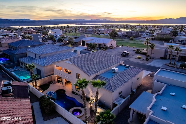 drone / aerial view featuring a residential view and a mountain view