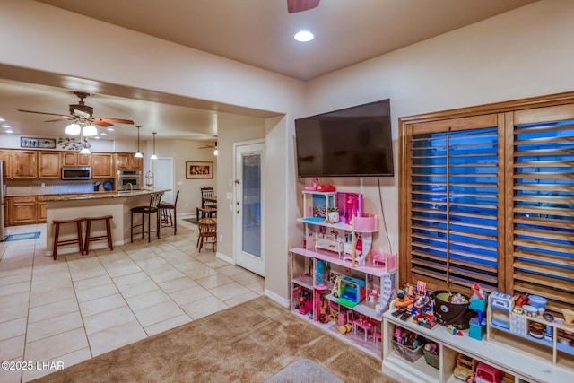 game room with recessed lighting, baseboards, ceiling fan, and light tile patterned flooring