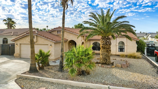 mediterranean / spanish-style home featuring a garage