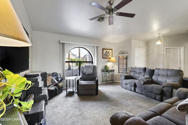 living room featuring vaulted ceiling, ceiling fan, and carpet floors