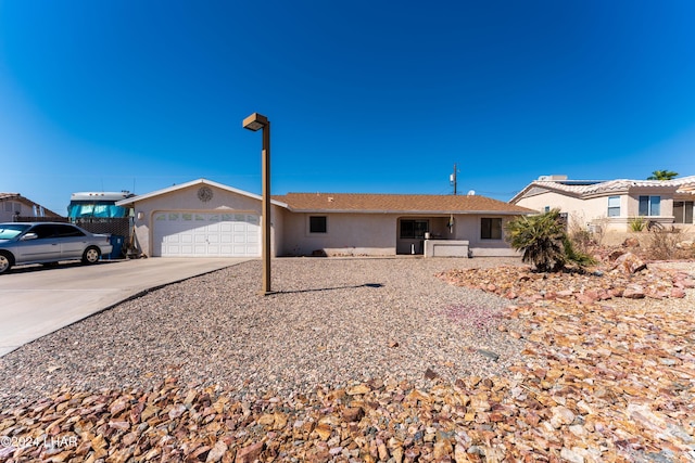 ranch-style house featuring a garage