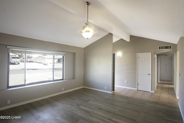 151 Viscount Ln, Lake Havasu City, AZ 86403 - spare room featuring visible vents, vaulted ceiling with beams, baseboards, and wood finished floors