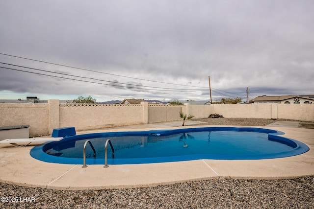 151 Viscount Ln, Lake Havasu City, AZ 86403 - view of pool with a patio area, a fenced in pool, a fenced backyard, and a diving board