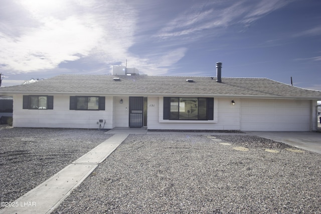 151 Viscount Ln, Lake Havasu City, AZ 86403 - ranch-style house with an attached garage, driveway, and a shingled roof