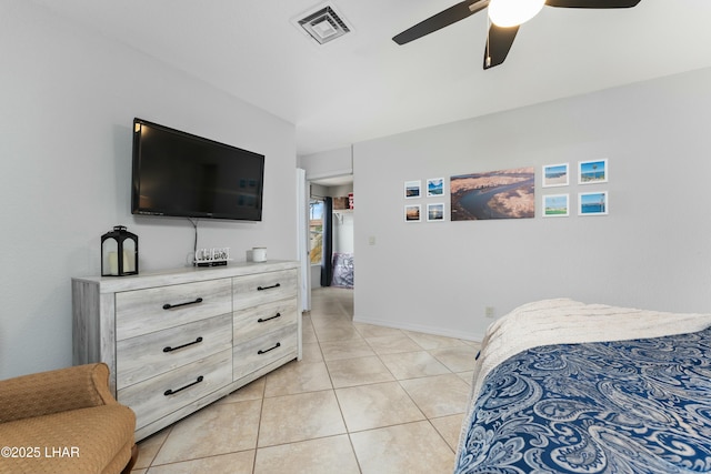 bedroom featuring light tile patterned flooring, a ceiling fan, and visible vents