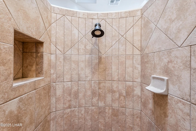 details featuring visible vents and tiled shower