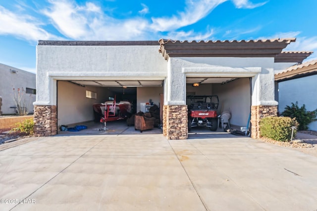 garage featuring driveway