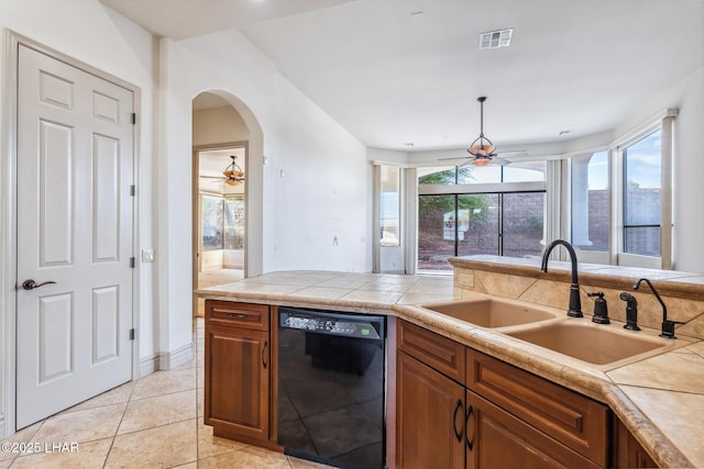 kitchen featuring dishwasher, visible vents, a sink, and ceiling fan