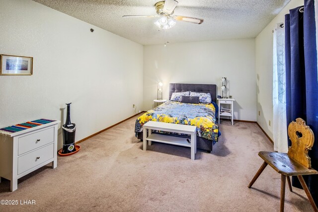 carpeted bedroom with ceiling fan and a textured ceiling