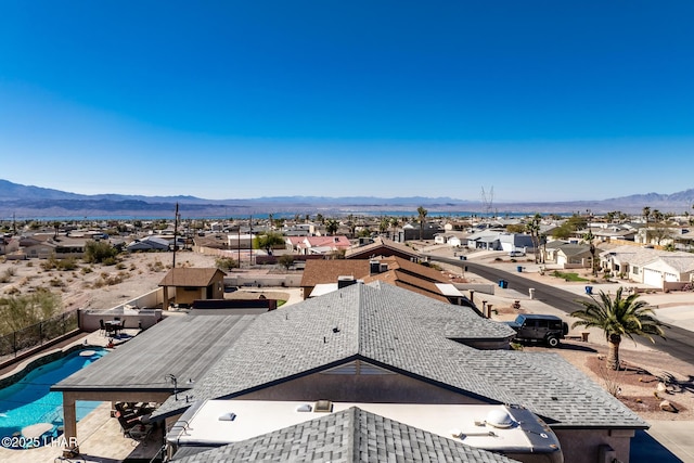 birds eye view of property featuring a mountain view