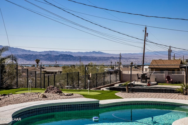 view of pool with a mountain view