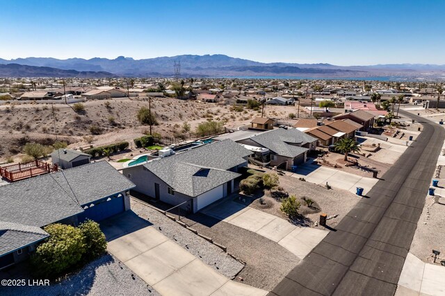 birds eye view of property featuring a mountain view