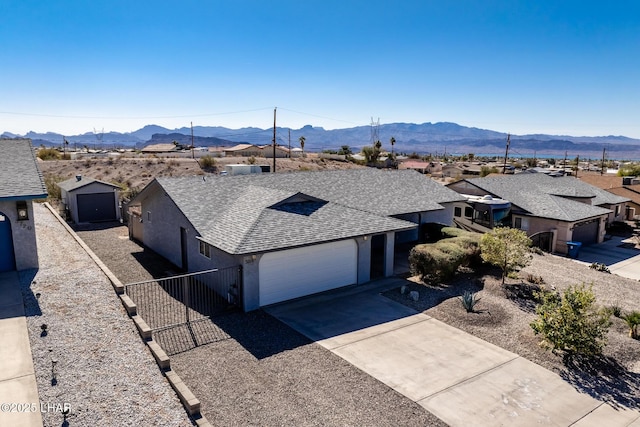 birds eye view of property with a mountain view