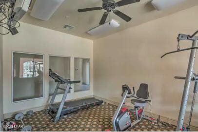 workout room with ceiling fan, carpet flooring, and visible vents