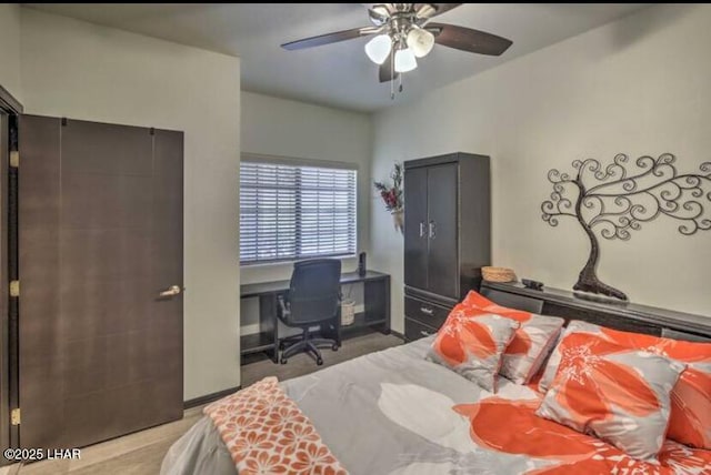 bedroom featuring ceiling fan and wood finished floors