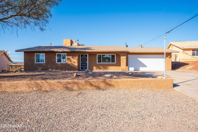 ranch-style home featuring a garage