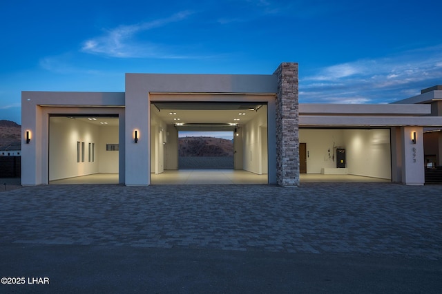 garage at dusk with water heater