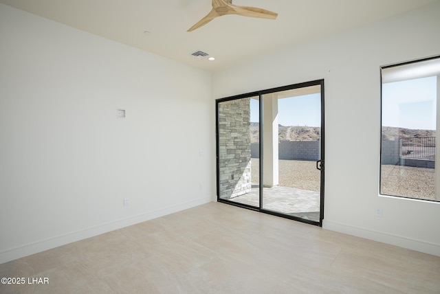 unfurnished room with ceiling fan