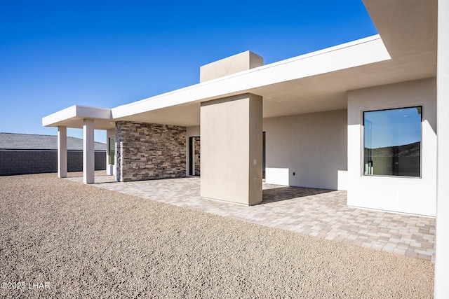 rear view of property featuring a patio