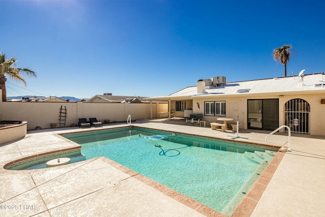 view of pool featuring central AC and a patio area