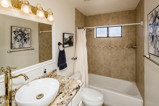 full bathroom featuring vanity, toilet, and shower / tub combo with curtain