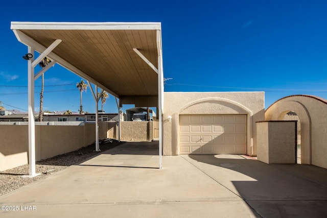 view of patio with a carport and a garage