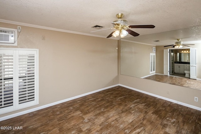 empty room featuring crown molding, ceiling fan, a textured ceiling, and dark hardwood / wood-style flooring