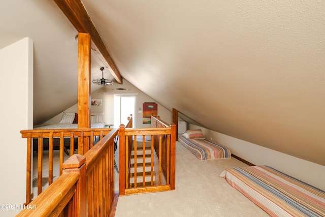 additional living space featuring carpet floors and vaulted ceiling